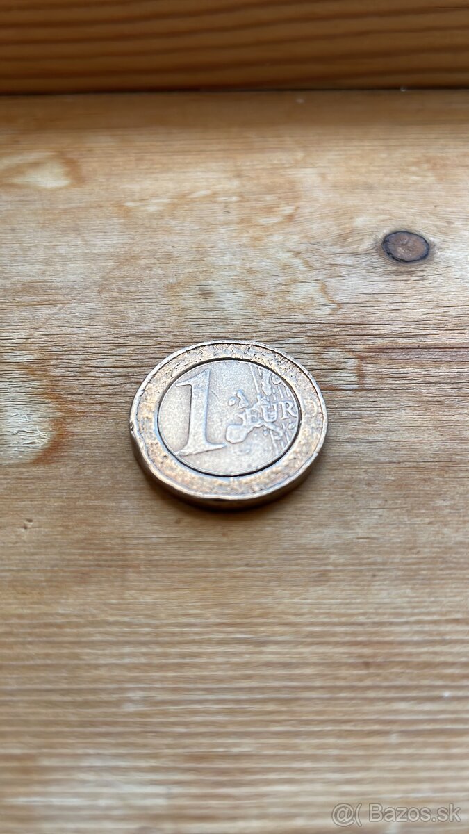 1€ minca Rakúsko 2002 , poškodená vypadnutý stred