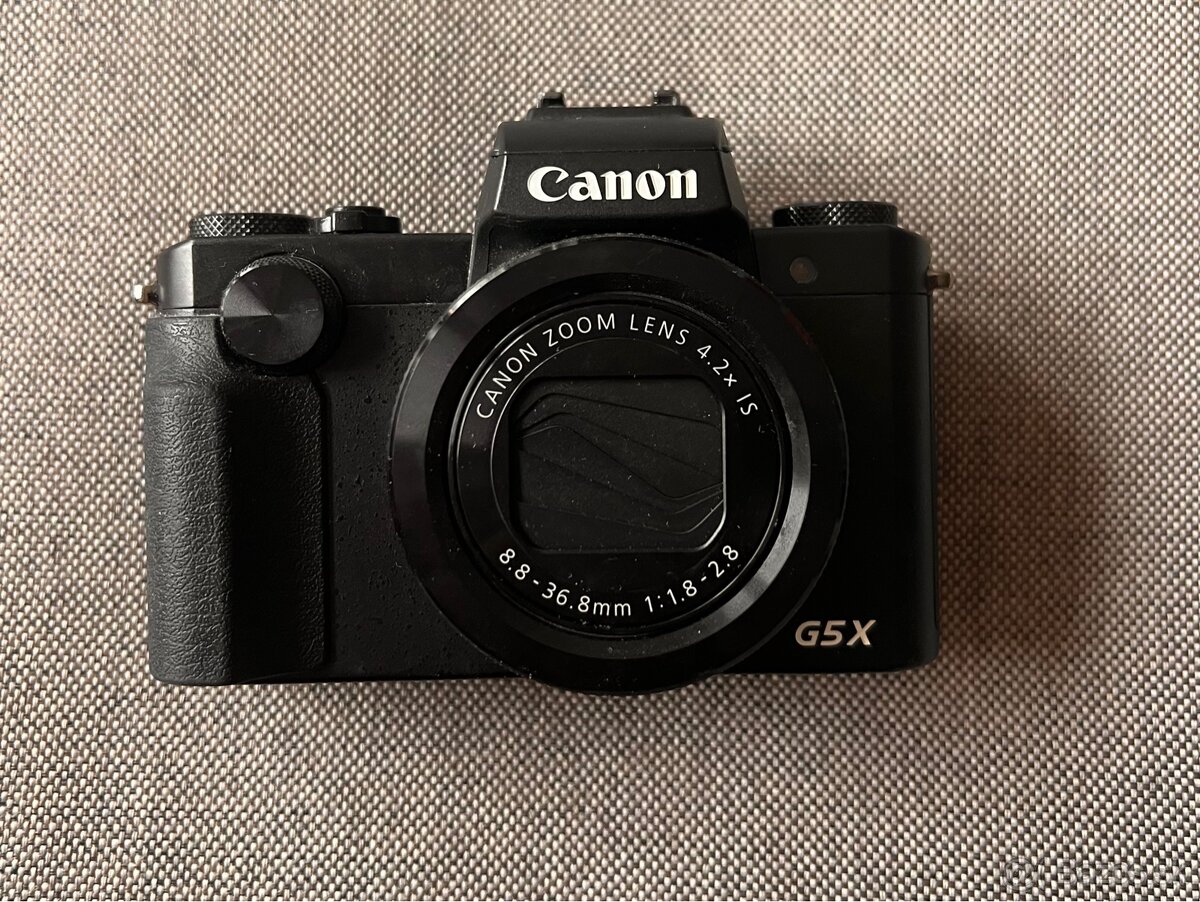 Canon g5x 20.2mp. F/1.8-2.8