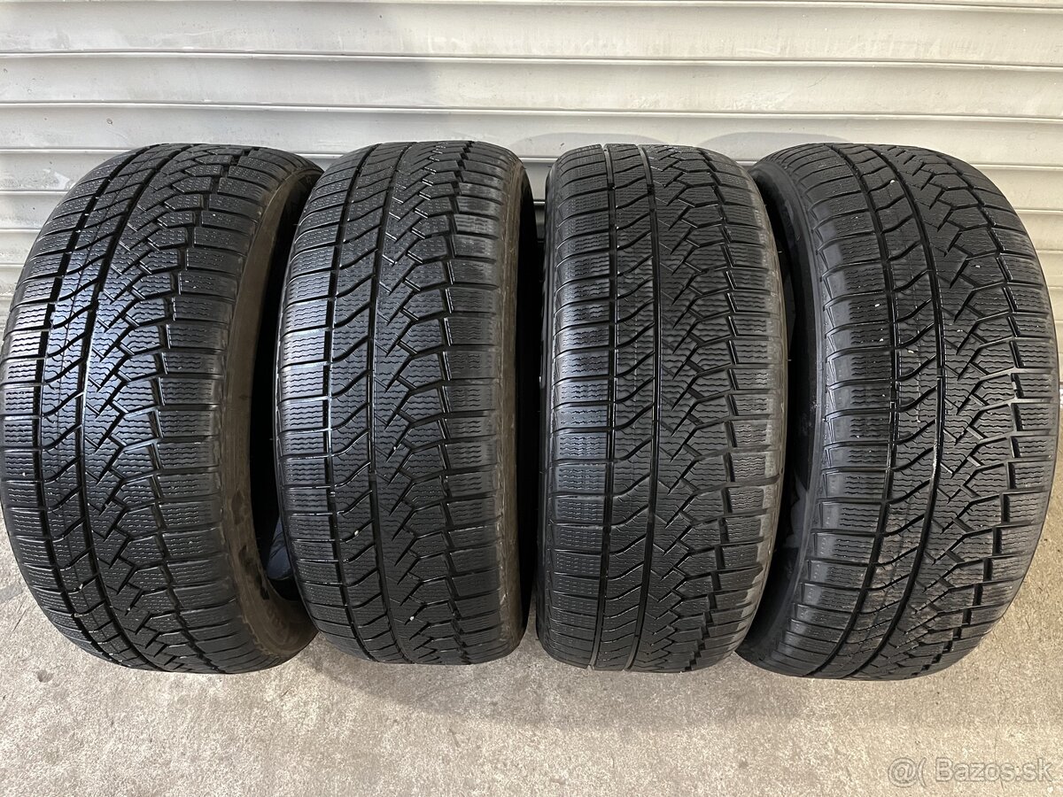 245/50R18 104V