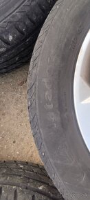 Plechové disky Opel + puklice + letné gumy 205/55 R16 - 11