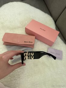Slnečné okuliare MIU MIU - 12