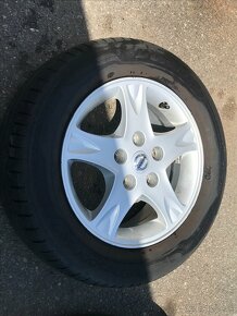 Alu kola Nissan Almera Tino 195/65 R15 - 12