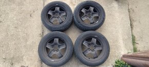 Plechové disky Opel + puklice + letné gumy 205/55 R16 - 14