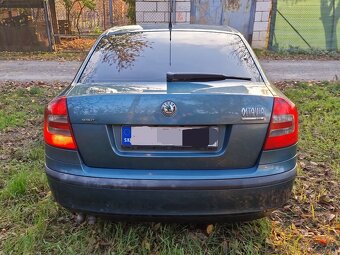 koda Octavia 1.9 tdi 77kw 105 ps sedan modrozelená METALIZA - 17