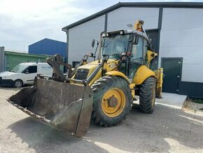 Traktorbager new holland 115b - 1