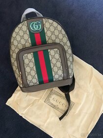 ruksak GUCCI + nohavice.