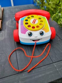 Malo hrany Fisher Price telefonik na tahanie