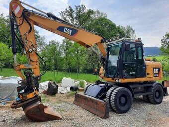 Caterpillar M313D kolesový bager