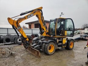 Kolový otočný bagr JCB 110 WT. T4