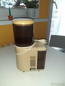 Elektricky mlynček na kavu ETA.
