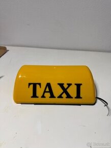 Nepoužitý (poškodený) žltý svietiaci transparent TAXI