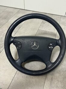 Tmavomodrý kožený Mercedes benz volať w208