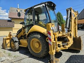 Kolesovy bager Caterpillar 428E