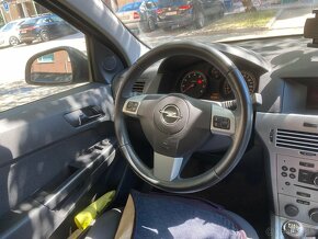 Opel Astra Caravan H 2012 - 2