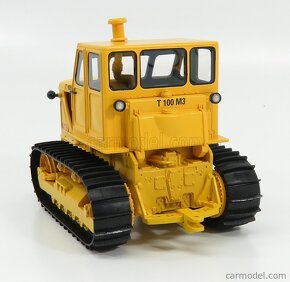 Model pásový traktor t 100 M3 1:32 schuco - 2