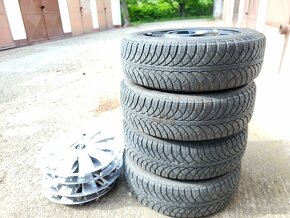 Plechové disky 4x100R14  HYUNDAI obute zimné pneu. 175/65/14 - 2