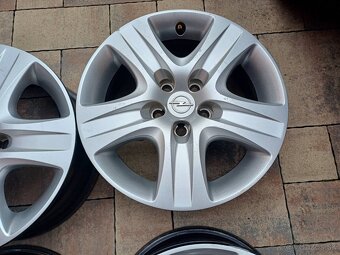 Plechove disky s puklicami Opel-6 1/2Jx16-ET-39-5x110 - 3