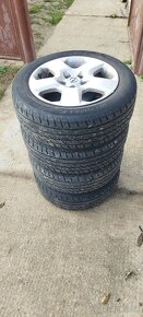 Plechové disky Opel + puklice + letné gumy 205/55 R16 - 5