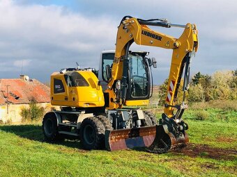 Kolesové rypadlo Liebherr A910 - 6