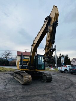 Pásové rypadlo Caterpillar 320W - 7