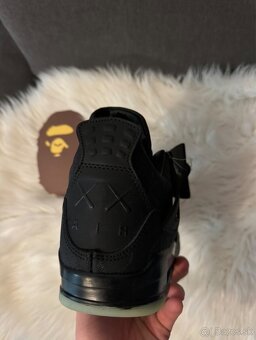 Jordan 4 black kaws - 7