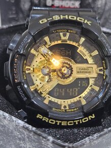 G SHOCK CASIO GOLD/BLACK - 7