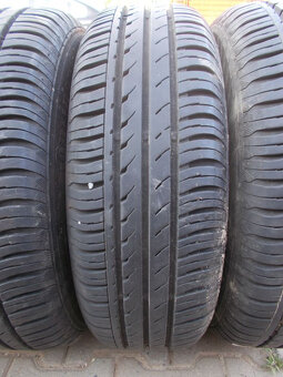 Plechové disky Ford + 185/65R14 - 7