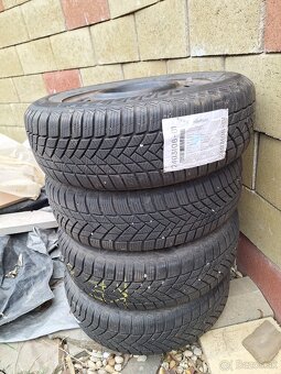 Kia plechové disky + zimné pneu 185/65  R15 + puklice KIA - 8